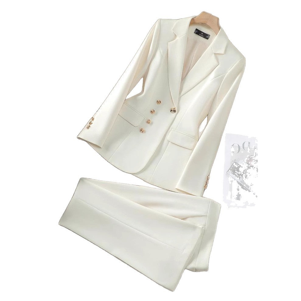 Women's formal white blazer and pant suit set with stylish golden buttons, ideal for elegant workwear attire.