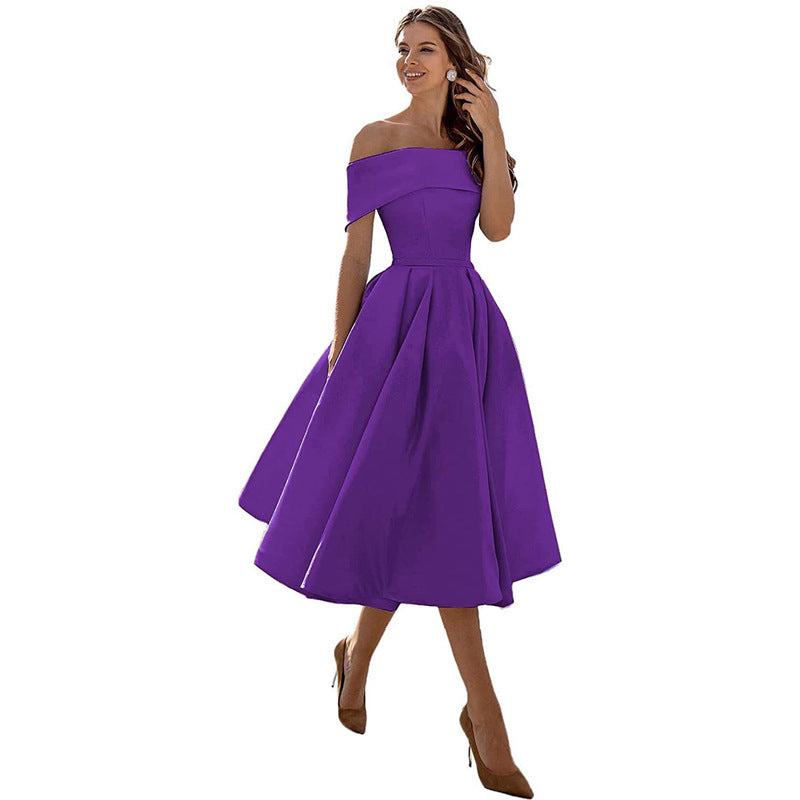 Women's strapless dress with a flattering fit, perfect as a versatile cocktail or special occasion party dress.