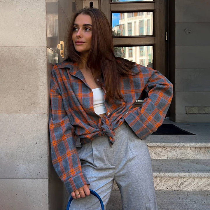 Chic women's oversized plaid check shirt, versatile long-sleeve button-up for everyday fashion.
