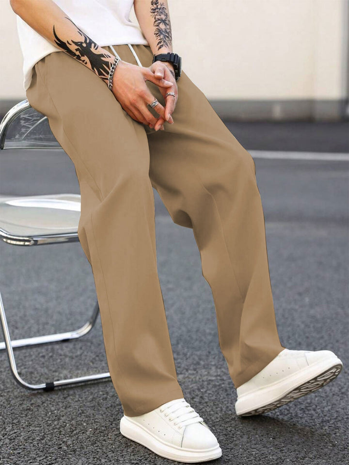 Men's stylish elastic waist leisure pants, loose fit for ultimate comfort and everyday wear.