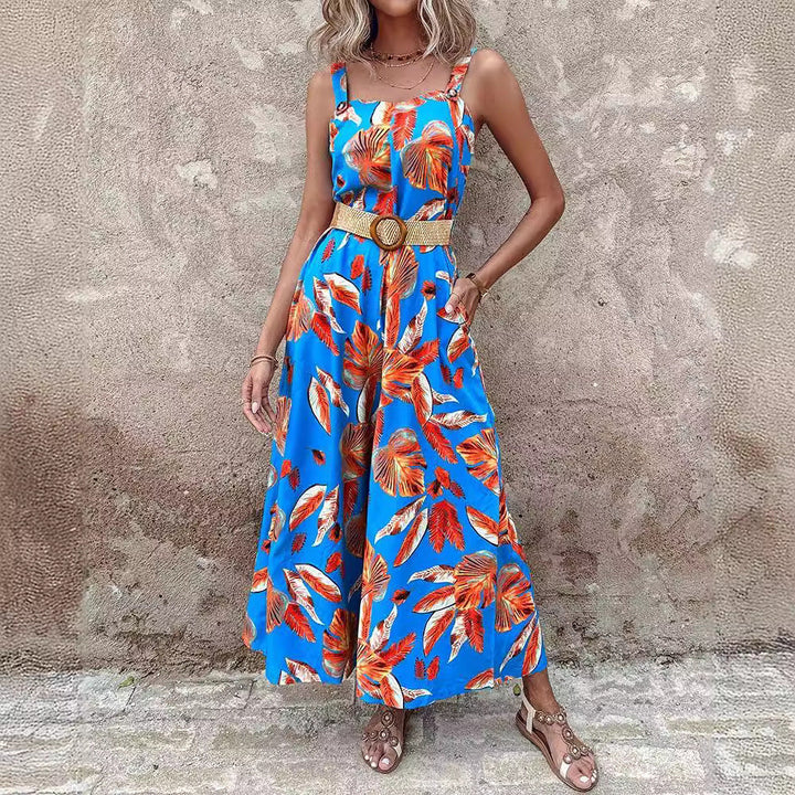 Stylish women's tropical print maxi jumpsuit, wide-leg & strappy, perfect for elegant summer vacations.