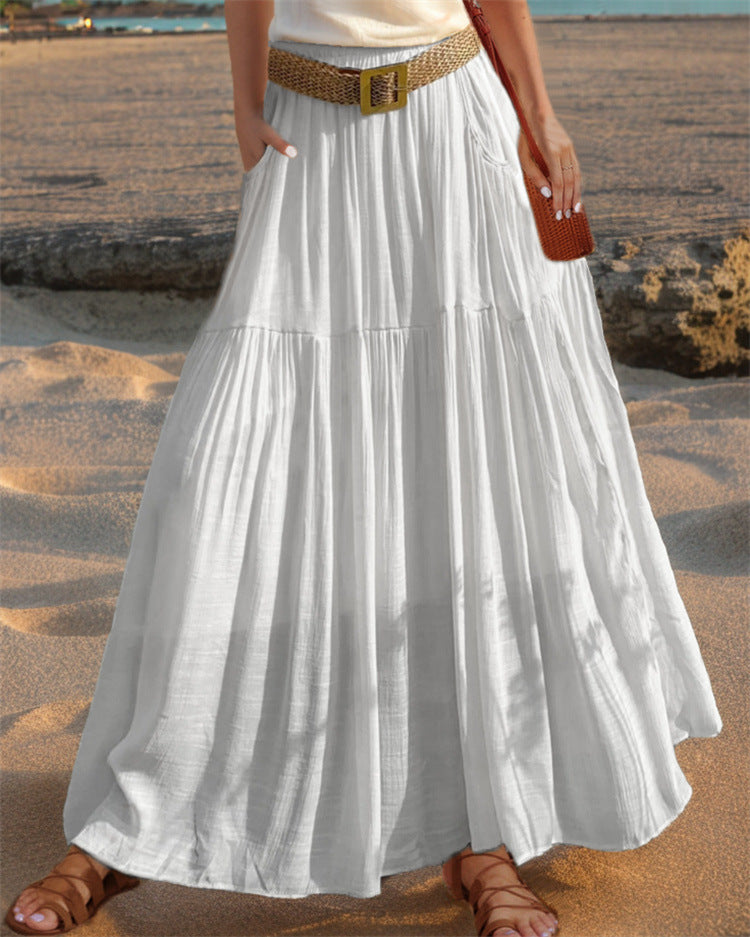 Comfortable women's maxi pleated skirt with pockets, versatile for various summer outfits.