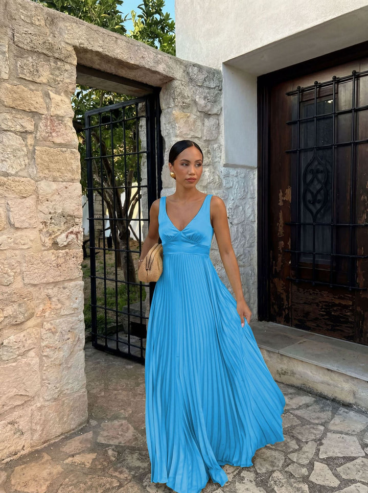 Elegant womenswear: Sleeveless V-neck pleated midi dress. Ideal for formal or casual summer events.