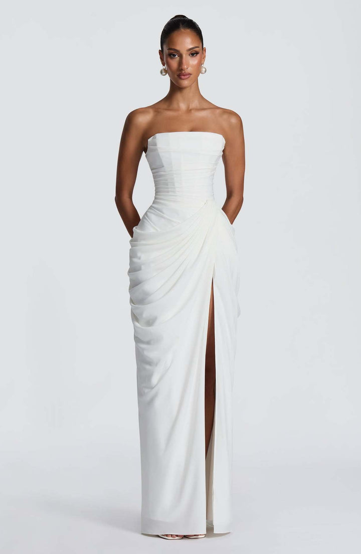 Elegant women's long sleeve evening gown, draped detail and high slit. Perfect for formal events and parties.