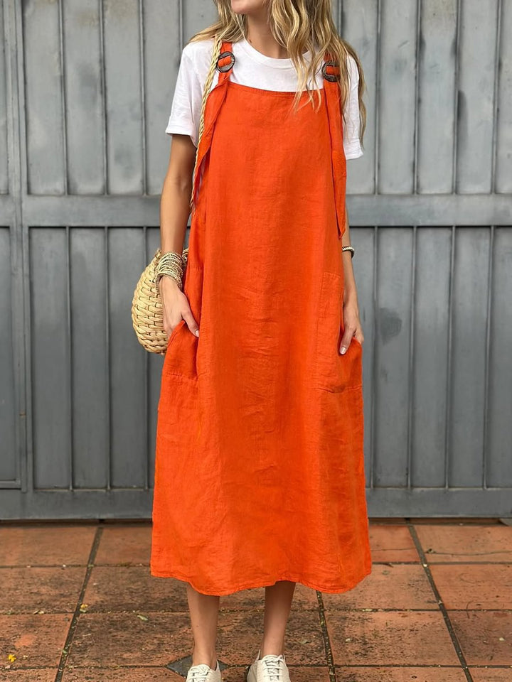 Elegant yet casual women's summer dress, relaxed fit, with adjustable straps & two functional pockets.