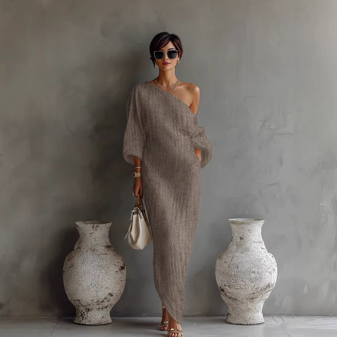 Chic women's one-shoulder formal dress in ivory. A flowing maxi gown for elegant parties & special events.