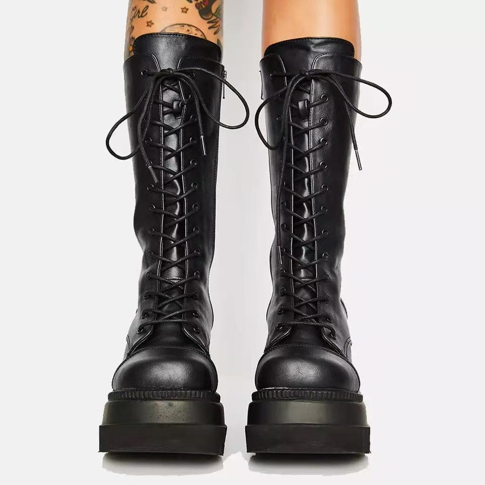 High-quality black fashion boots for women, featuring a secure lace-up front, platform sole, and side zip.