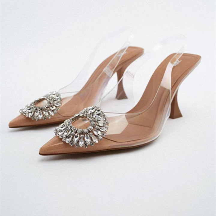 Elegant transparent women's pumps with sparkling jewel detail, perfect for evening wear.