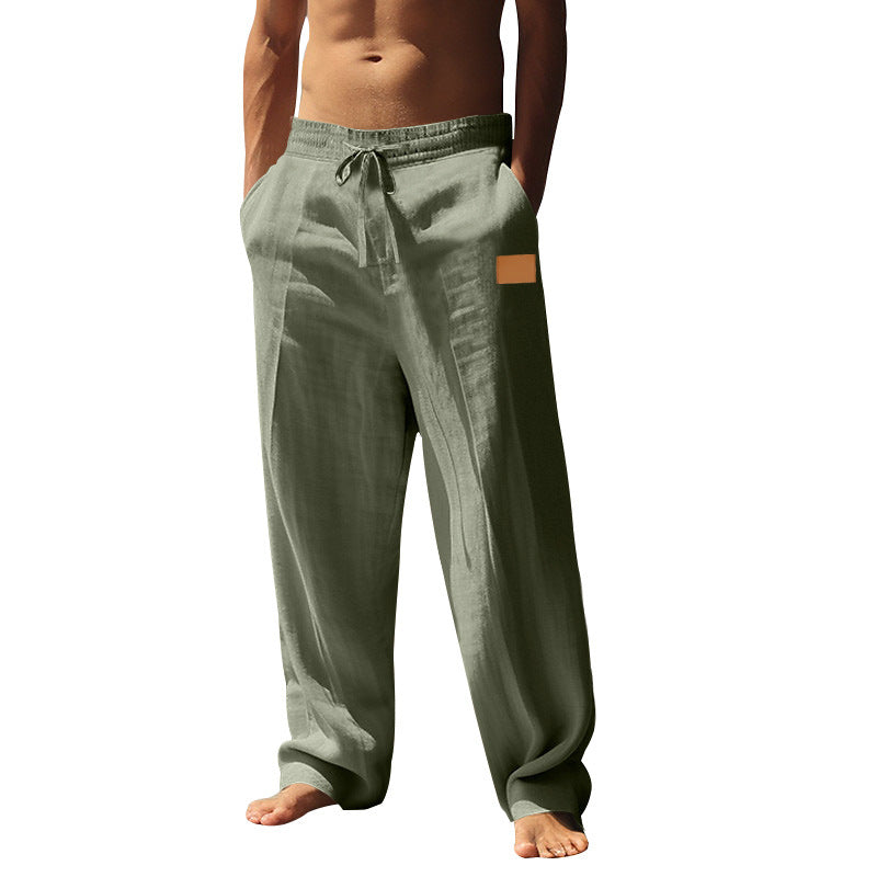 Relaxed fit men's casual pants with elastic waist, perfect for beachwear & summer comfort.