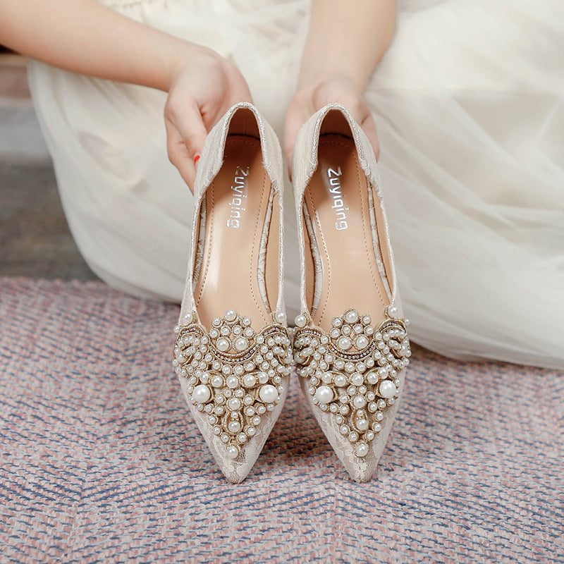 Sophisticated women's wedding flats, featuring ornate lace & pearl embellishments, offering elegance & comfort.