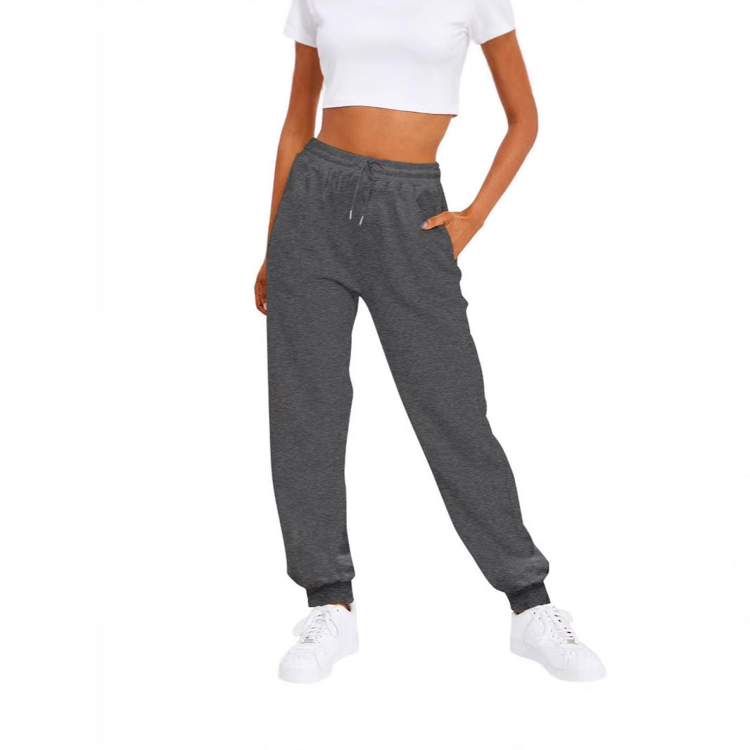 Comfortable women's lounge wear pants with elastic waistband & pockets, great for relaxing or casual outings.