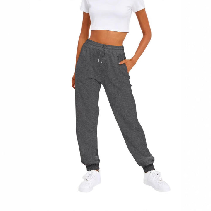 Comfortable women's lounge wear pants with elastic waistband & pockets, great for relaxing or casual outings.