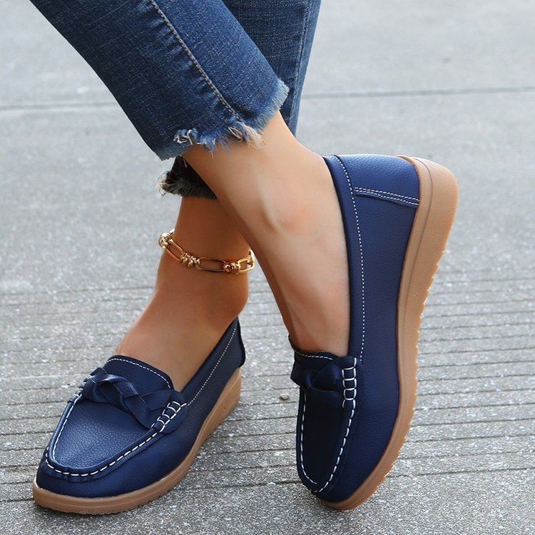 Women's moccasins with stylish bow applique, comfortable slip-on design, and non-slip sole for daily wear.
