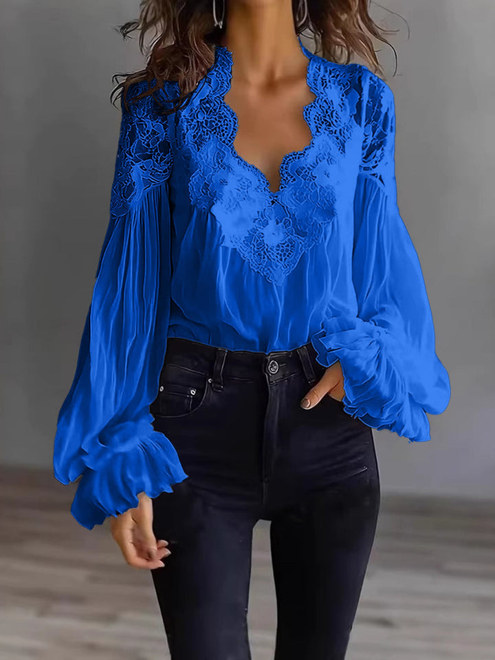 Classic white lace blouse for women, featuring a flowing cut and beautiful ruffle sleeve detail.