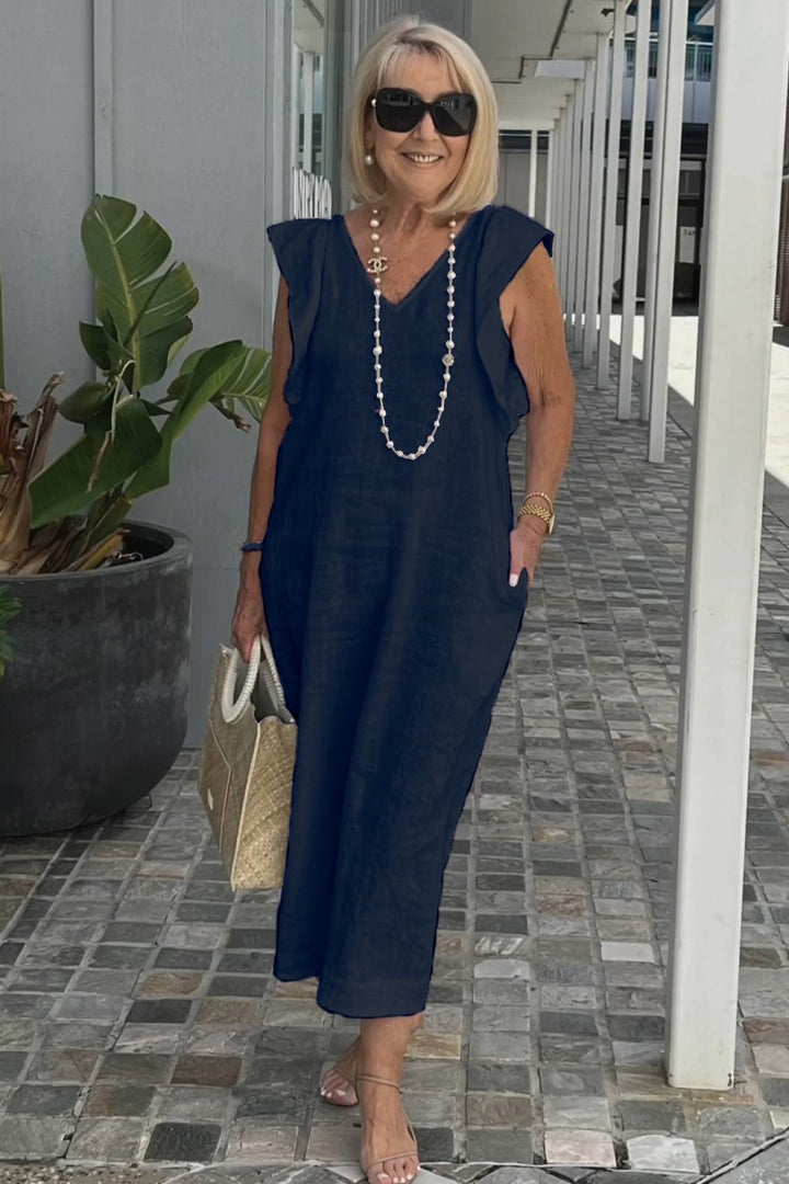 Casual sleeveless V-neck maxi dress for women, ideal for summer vacations; available in black, white, apricot.