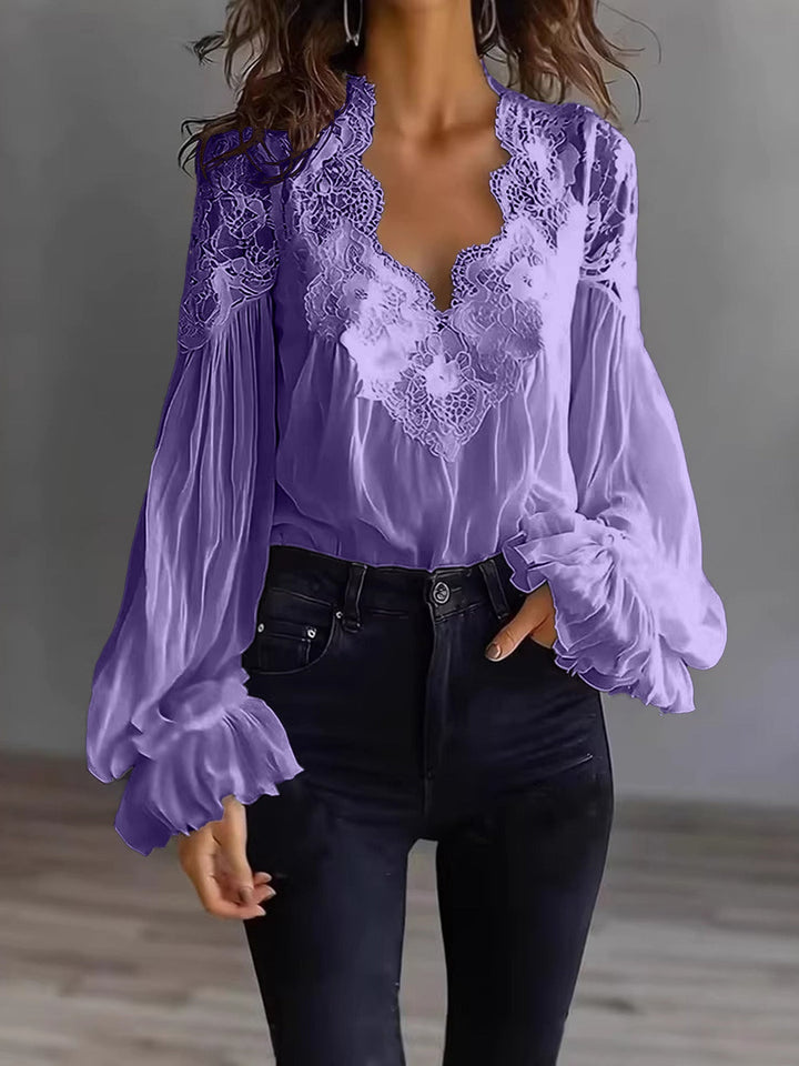 Chic white lace blouse for women, showcasing feminine ruffle sleeves; a versatile fashion staple.