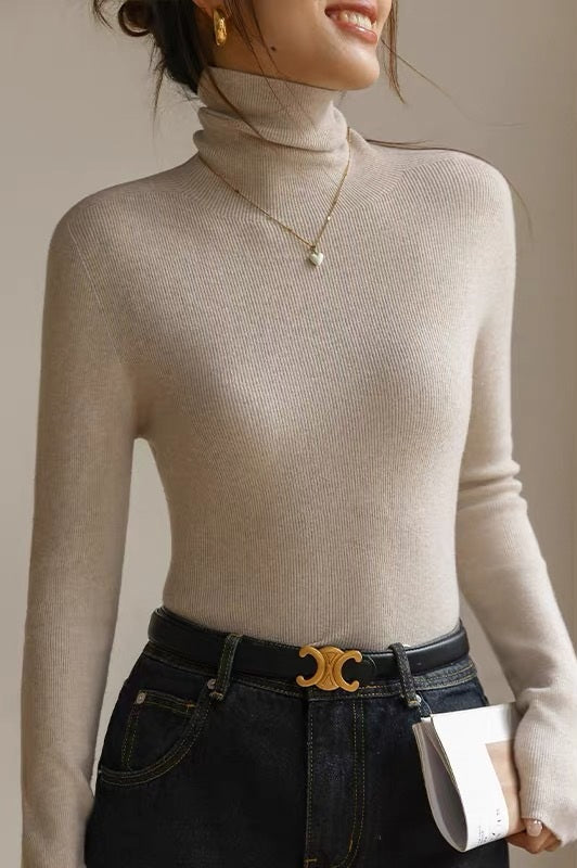 Detailed view of women's seamless high neck top, long sleeve with ribbed texture, a snug & warm winter layer.