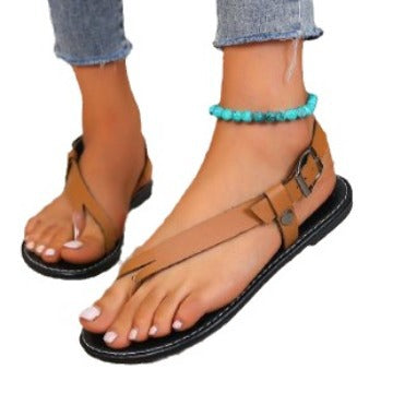 Fashionable slip-on women's thong sandals with an adjustable strap for a secure and comfortable fit.