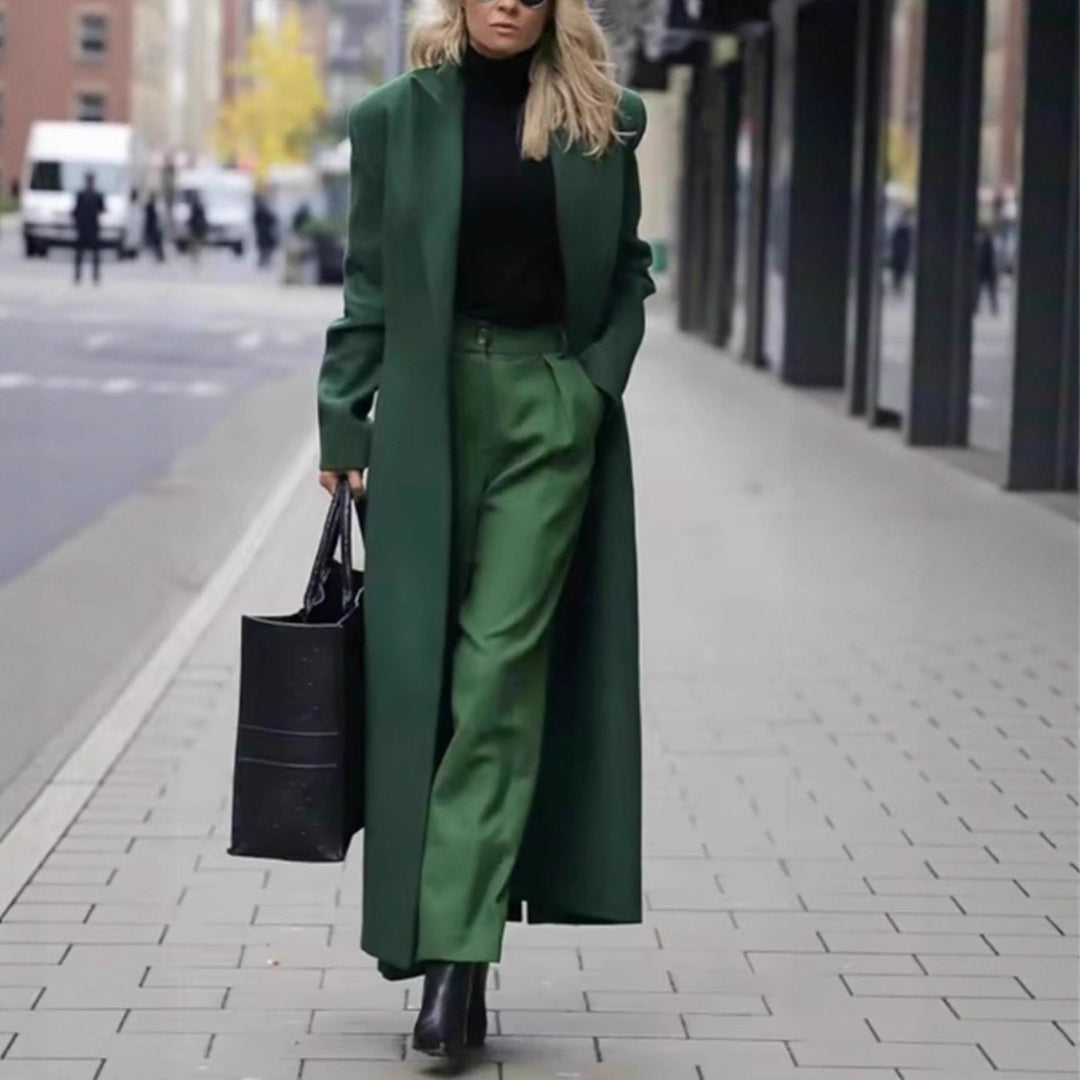Versatile women's elegant coat, double-breasted with deep pockets, ideal for fall fashion.