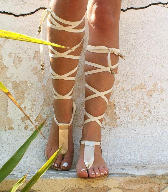 Vibrant yellow women's strappy flat sandals. Open-toe gladiator style for playful and chic summer footwear.