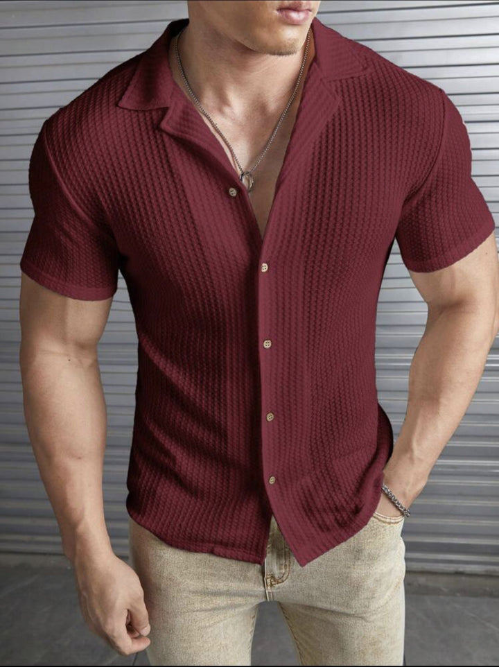 Men's red ribbed knit short sleeve shirt with button front & spread collar, perfect for smart casual summer wear.