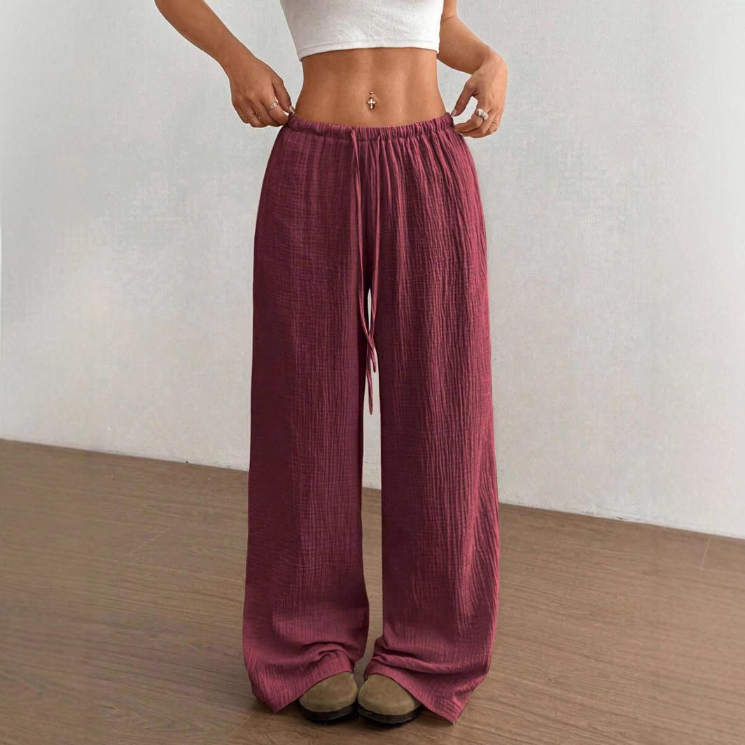 Lightweight women's wide leg flowy trousers, ideal for comfortable casual summer fashion and relaxed everyday style.