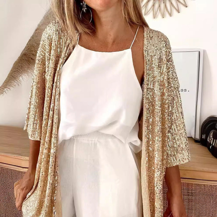 Elegant evening jacket: women's sequin cardigan with a glamorous sparkle and loose fit.