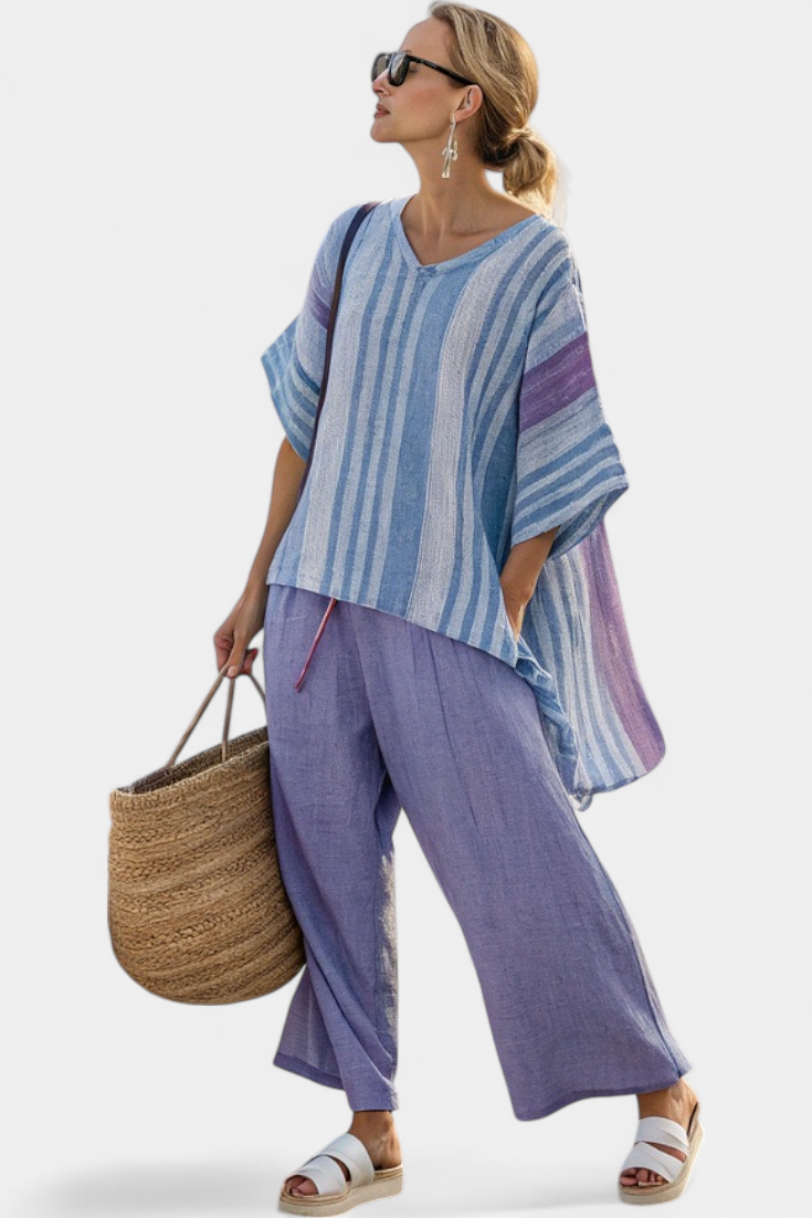 Fashionable women's lavender & sky blue striped coordinated set. Elegant top and wide-leg pants offer casual chic style.