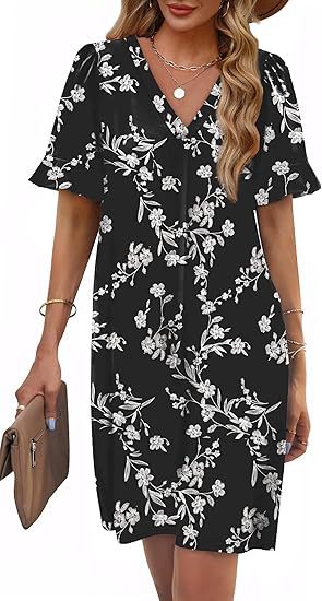 Close-up on the intricate floral print & flattering V-neck of this women's summer dress.