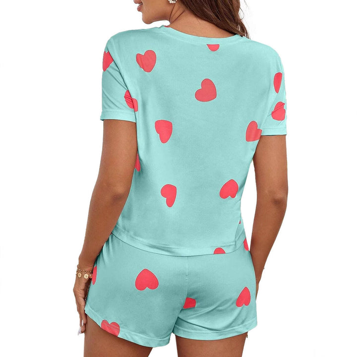 Soft fabric women's heart print loungewear set. Detail of the delicate heart pattern, perfect for cozy nights.