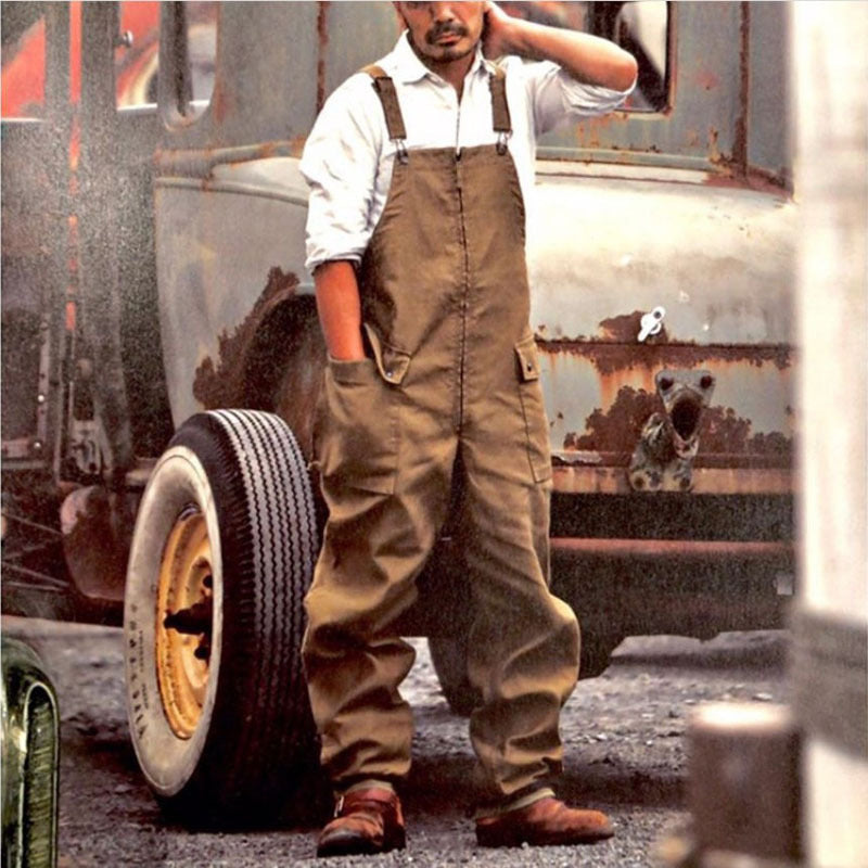 Rugged olive green men's overalls, ideal outdoor gear and durable clothing for demanding work environments.