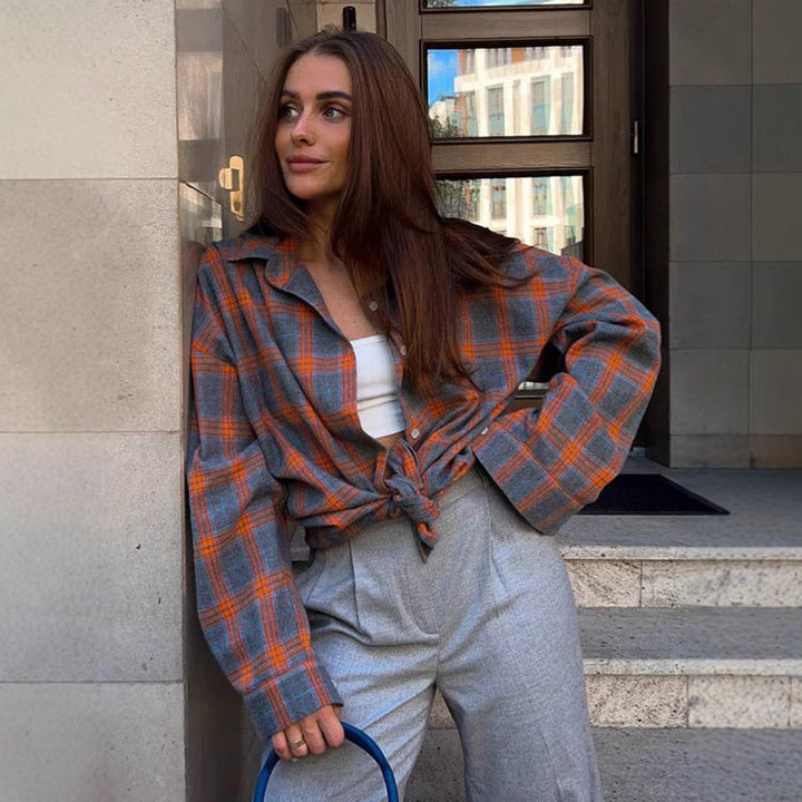Versatile women's oversized plaid shirt, button-up blouse, long sleeve, suitable for various casual outfits.