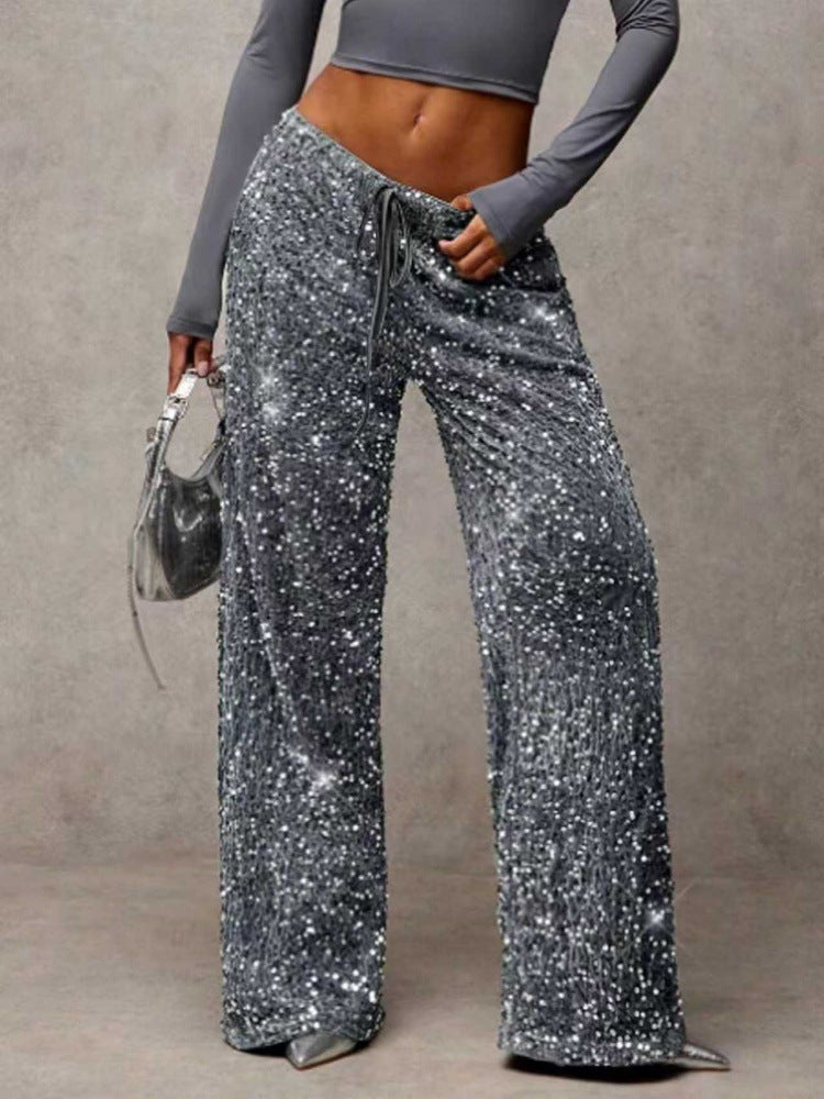 Flowing wide-leg sequin trousers for women, comfortable chic sparkle for any festive event.
