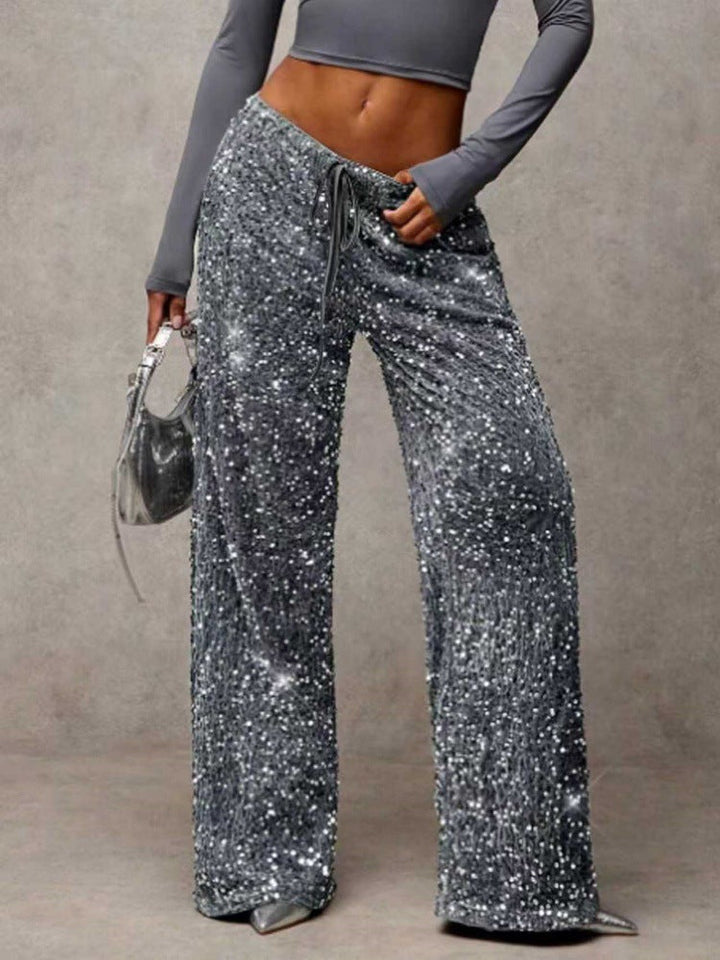 Flowing wide-leg sequin trousers for women, comfortable chic sparkle for any festive event.