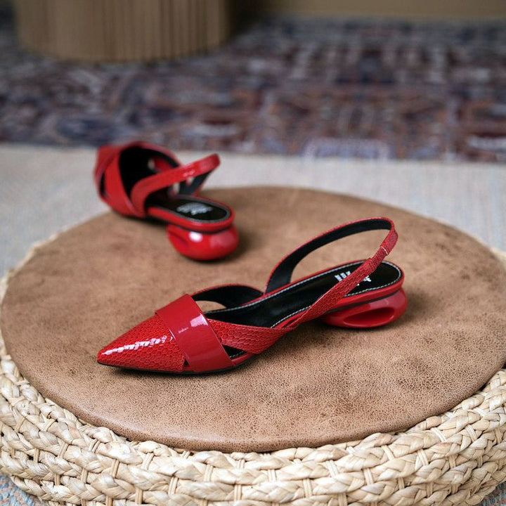 Modern silver slingback heels with metallic detail, pointed toe, stiletto heel, elegant women's party shoes.