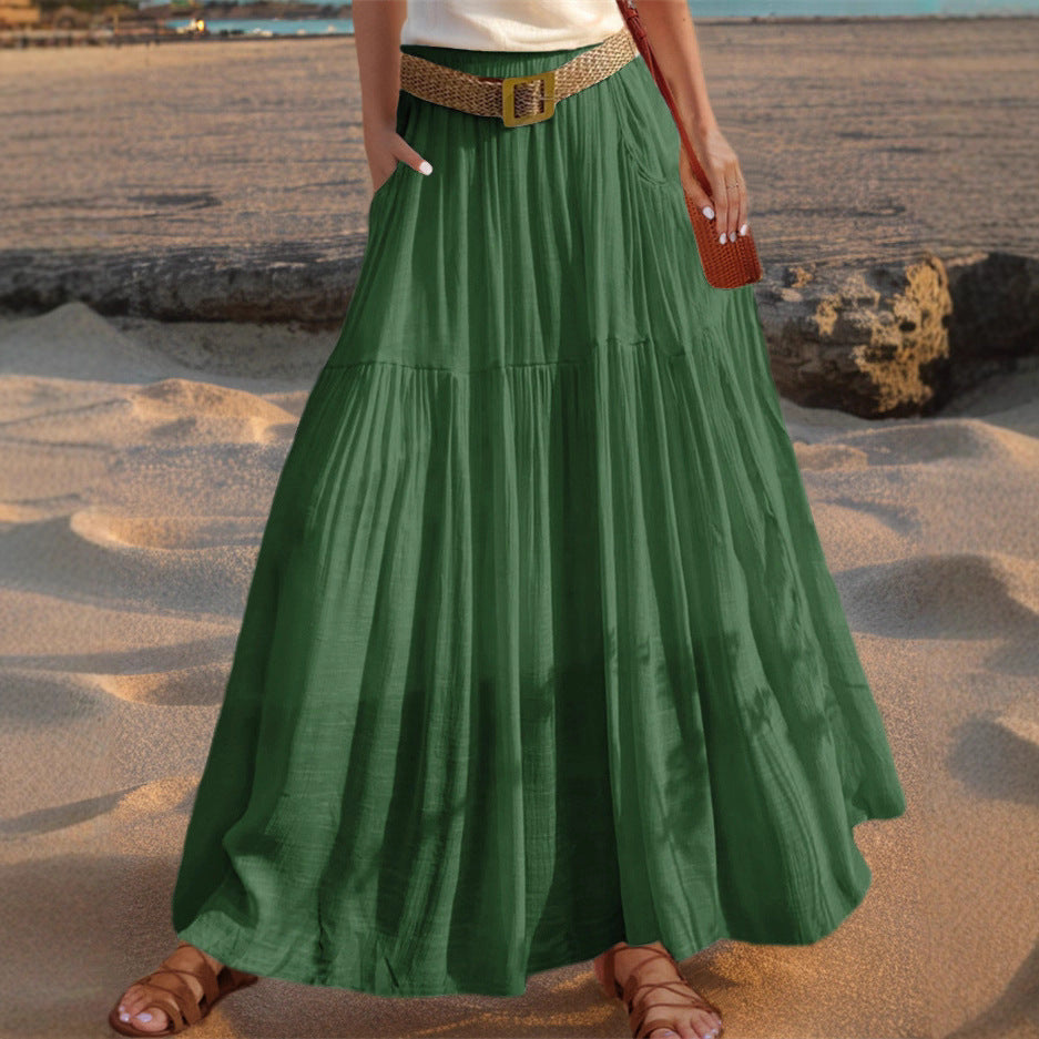 Elegant pleated maxi skirt for women with practical pockets, ideal for summer fashion.