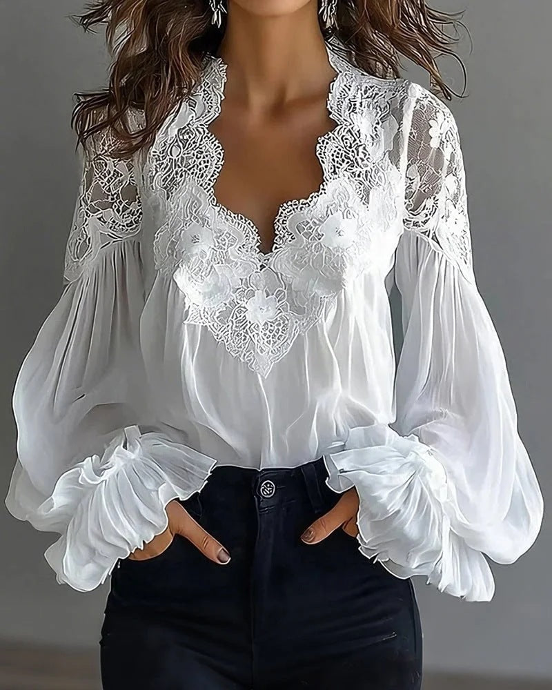 Fashion-forward women's white blouse, featuring intricate lace details and graceful ruffle sleeves.