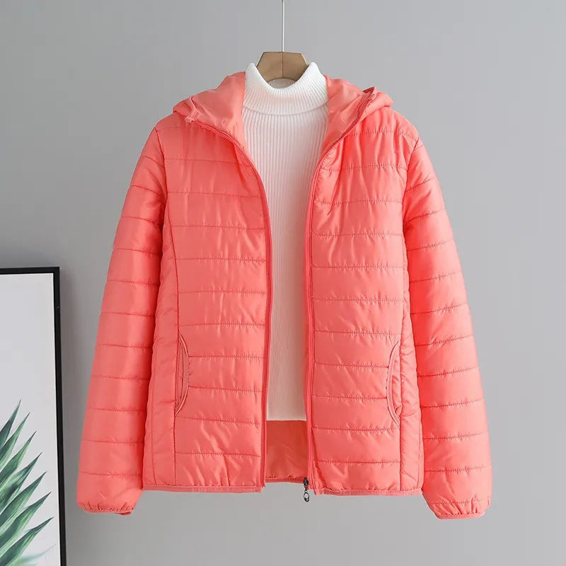 Lightweight ladies quilted hooded jacket in navy, ideal outerwear for changing seasons.