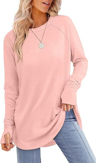 Woman wearing a modern cut long sleeve t-shirt, showcasing casual & stylish everyday fashion.