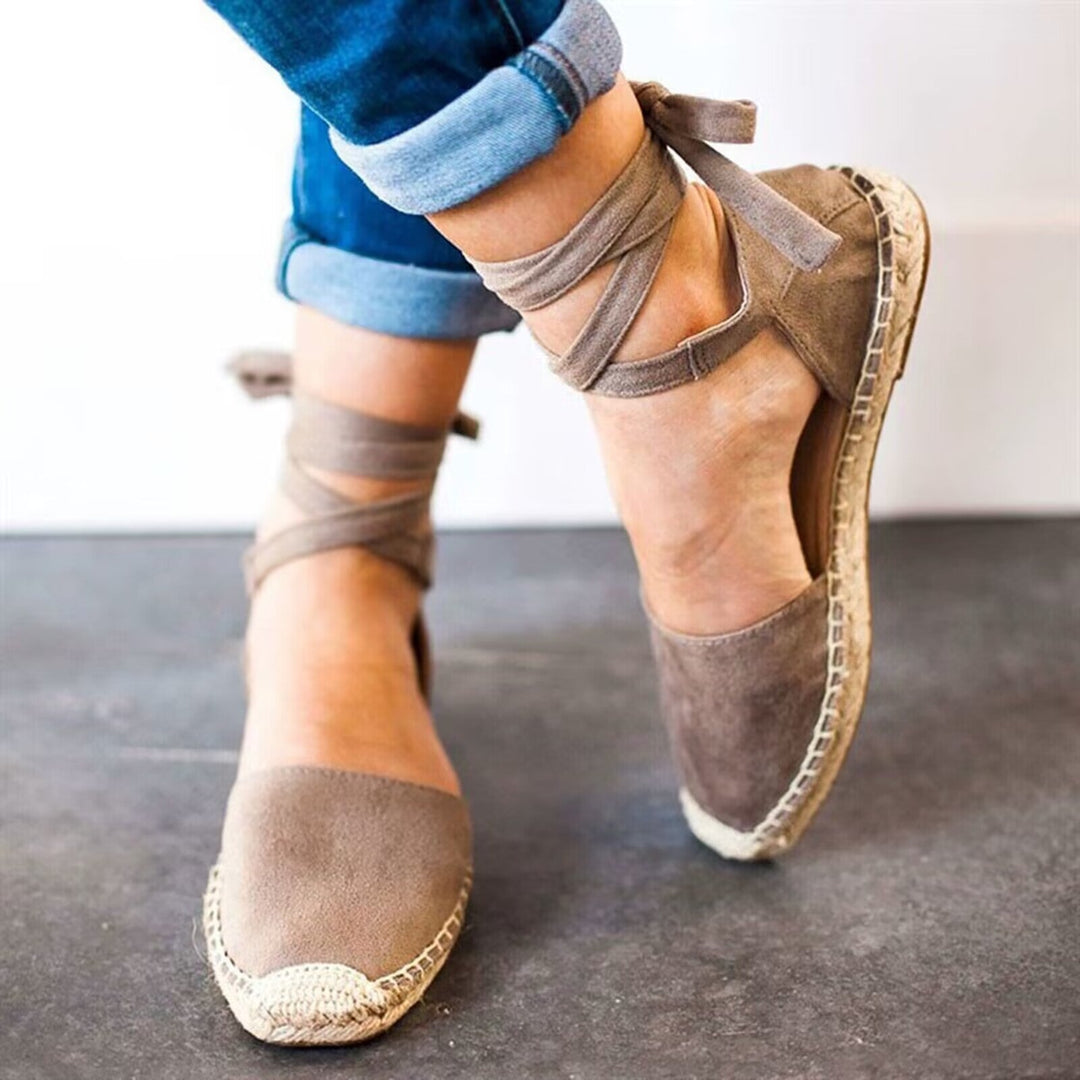 Women's comfortable espadrille sandals featuring stylish tie-straps, perfect for chic summer casual looks.
