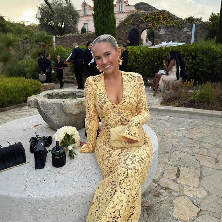 Chic women's V-neck lace maxi dress with elegant voluminous sleeves & a flattering tailored fit. Yellow evening wear.