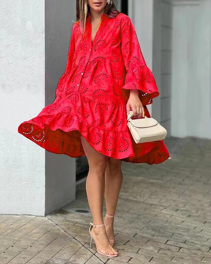 Back view of a chic women's tiered mini dress with voluminous balloon sleeves, a perfect summer party outfit.