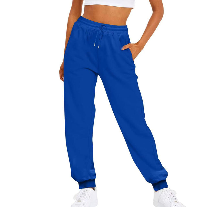 Women's versatile activewear joggers; comfortable, elastic waist, practical side pockets. Ideal for sport or casual use.