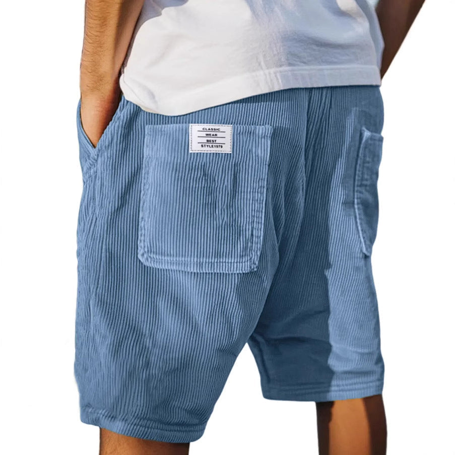 Modern men's refined textured tailored shorts, great for sophisticated smart casual outfits.