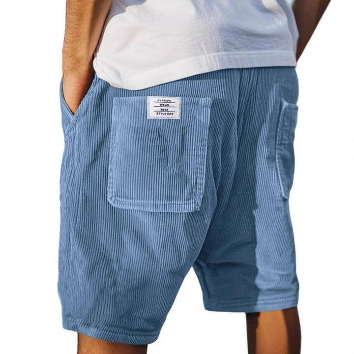 Modern men's refined textured tailored shorts, great for sophisticated smart casual outfits.