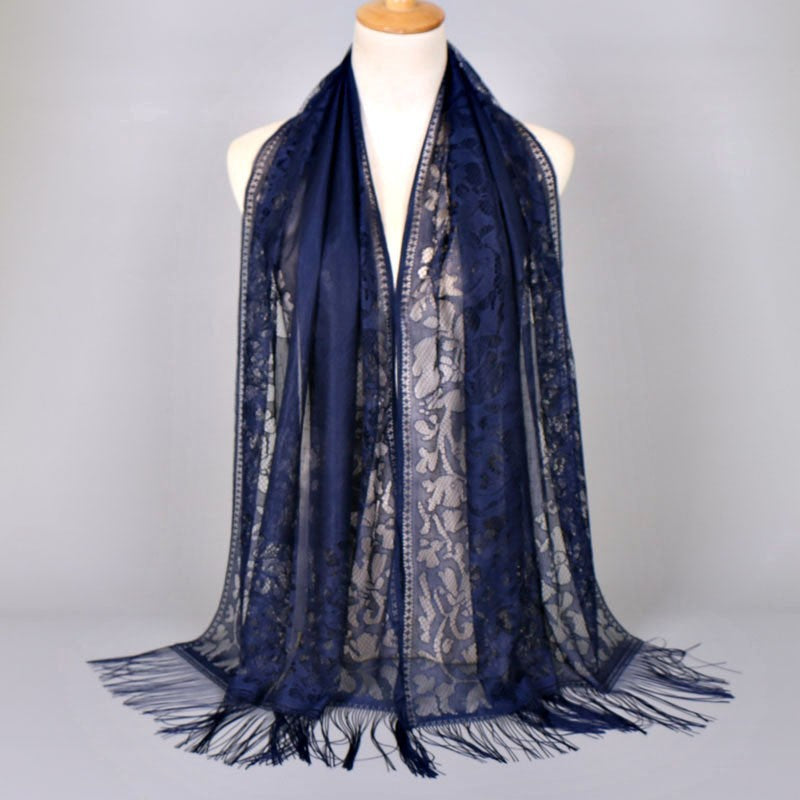 Women's elegant floral lace shawl, with stylish fringed edges, a versatile fashion piece for her.