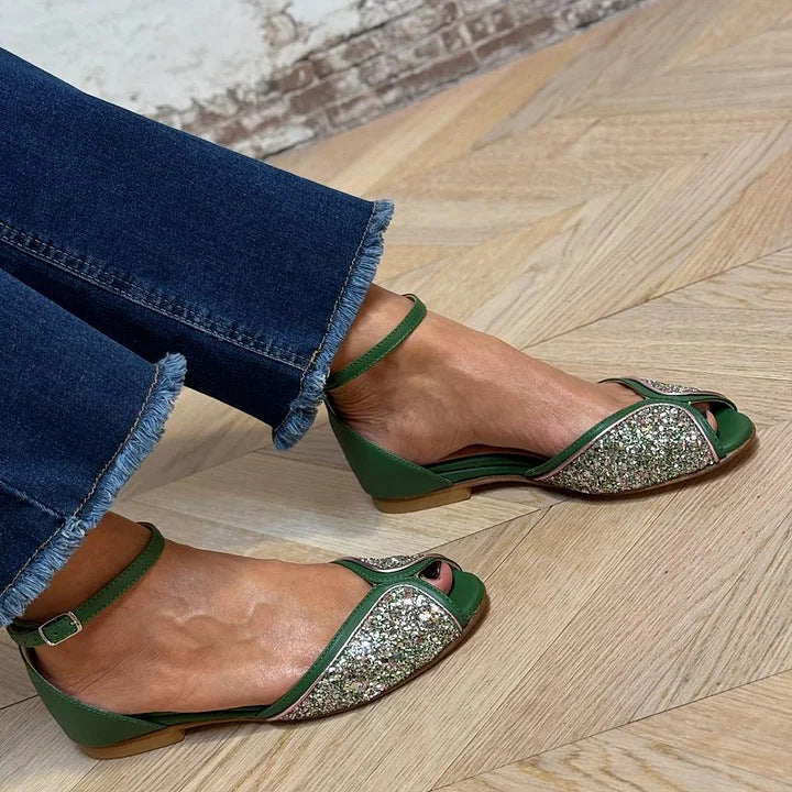 Elegant women's flat sandals with adjustable ankle strap, perfect for chic summer comfort.