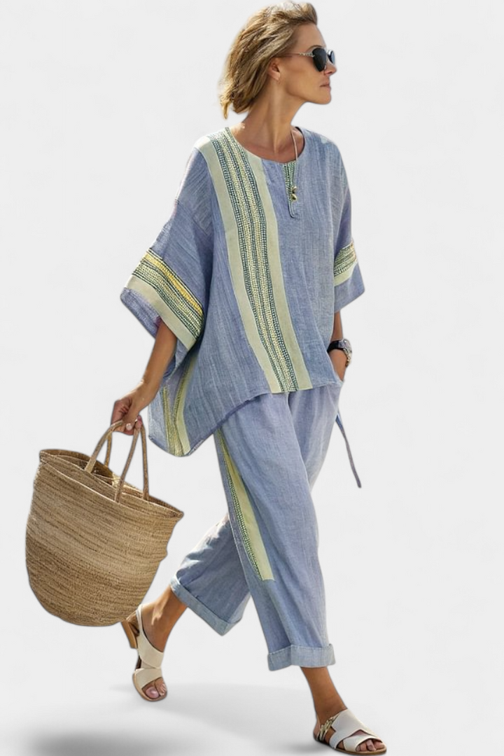 Complete women's striped outfit set: a chic top and comfortable pants for effortless summer styling.