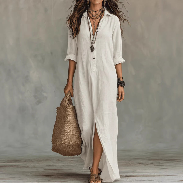 Casual women's long button-down shirt dress featuring a flowy design and fashionable side slit. Great for summer style.