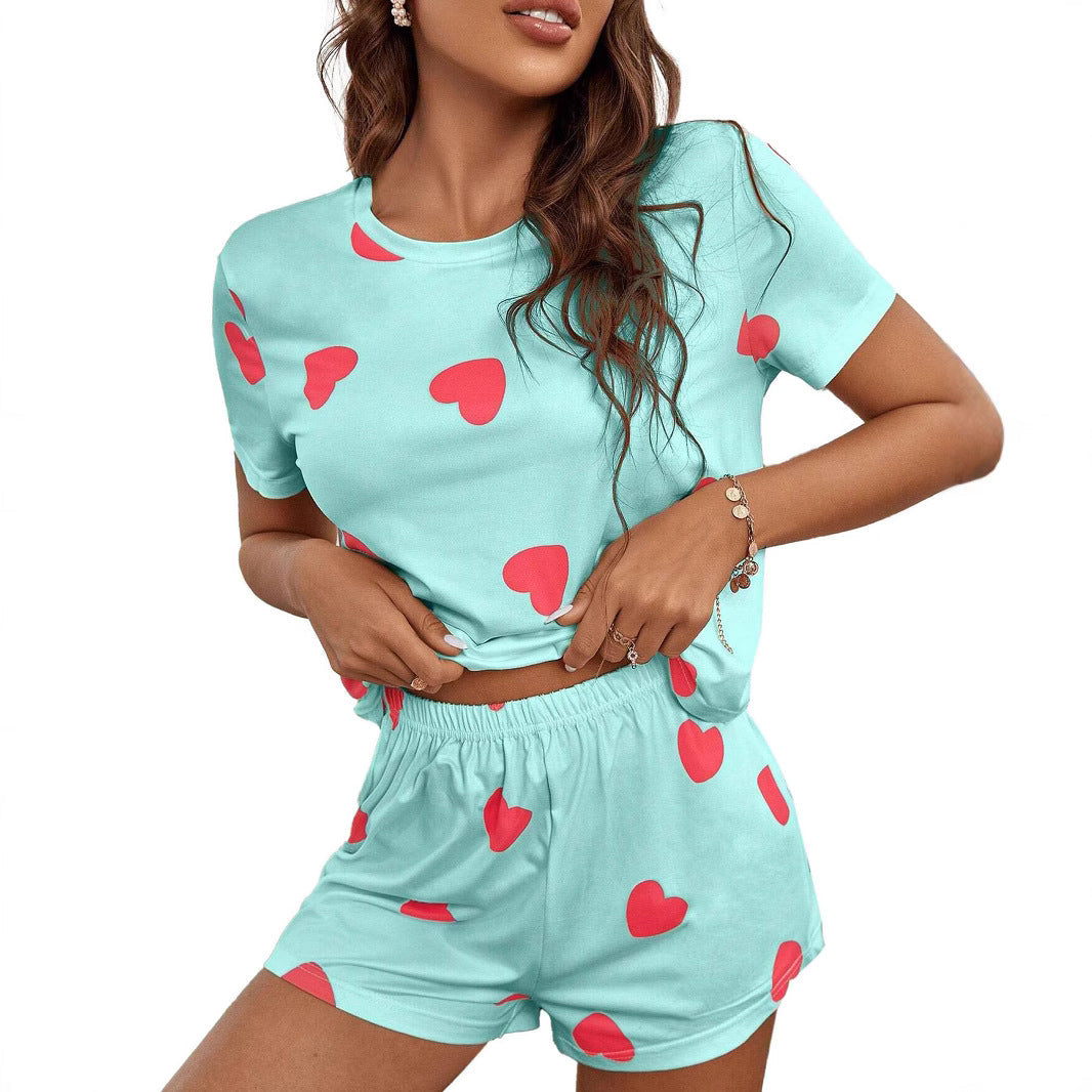 Sky blue loungewear set for women, featuring a charming white heart print. Stylish and comfortable casual wear.